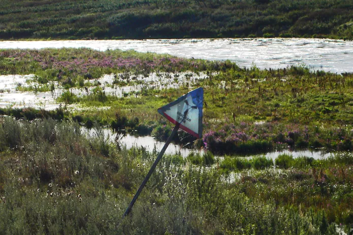 <em>Radioactive danger sign near the Techa River, 2007 /Photo: Alla Slapovskaya and Alisa Nikulina, Ecodefense, Heinrich Boell Stiftung Russia</em>