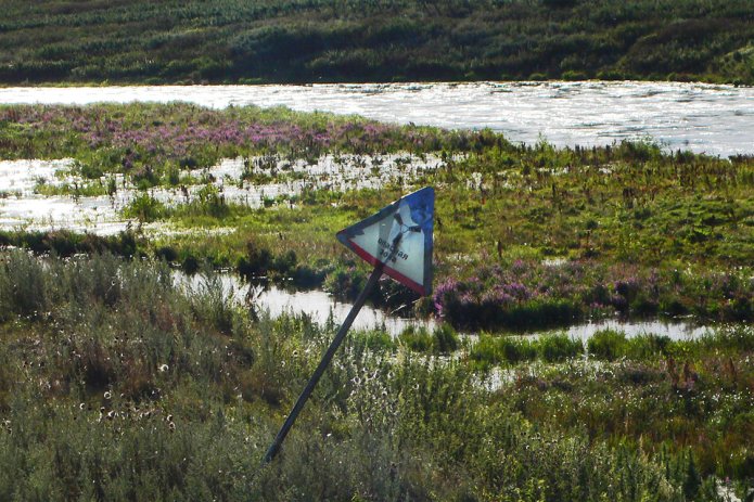 <em>Radioactive danger sign near the Techa River, 2007 /Photo: Alla Slapovskaya and Alisa Nikulina, Ecodefense, Heinrich Boell Stiftung Russia</em>